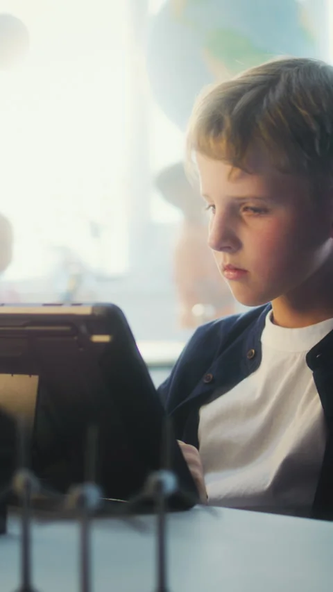 Elementary School Boy Writing Code for Advanced 3D Printer on Tablet Computer Stock Footage 311804831