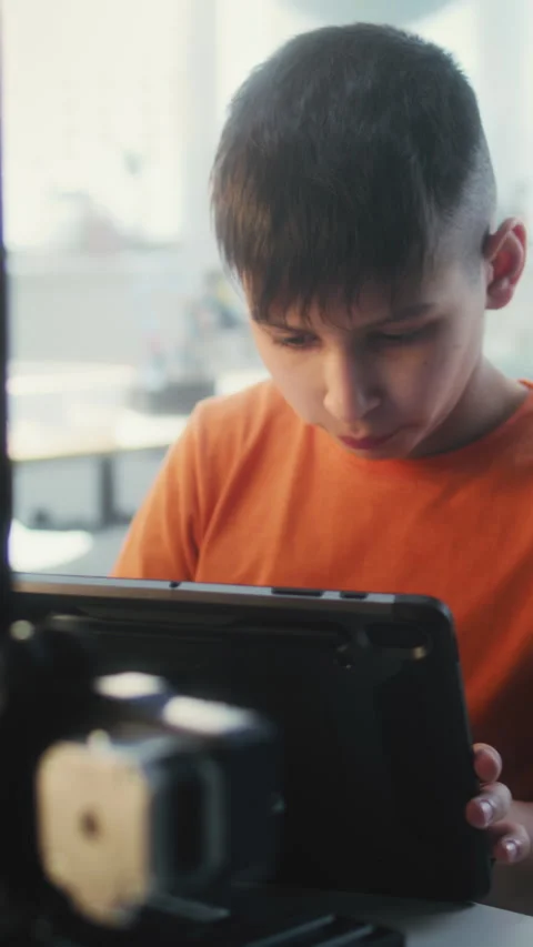 Elementary School Boy Writing Code for Advanced 3D Printer on Tablet Computer in Stock Footage 311804977