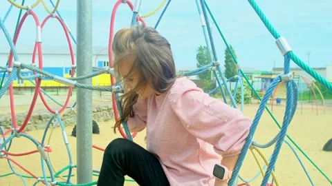 Elementary school child climbing on the school playground Stock Footage 277548959