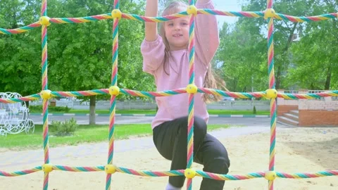 Elementary school child climbing on the school playground Stock-Footage 278738512