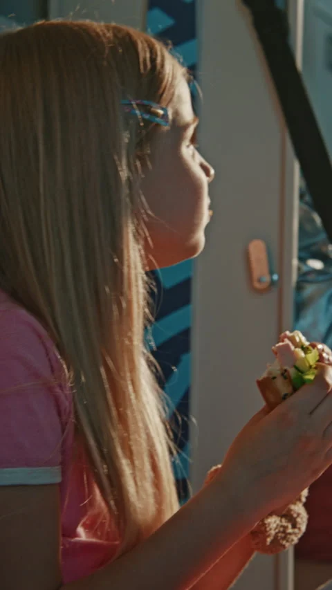 Elementary School Child Enjoying Packed Fresh Lunch While Sitting Comfortably in Stock Footage 342026057