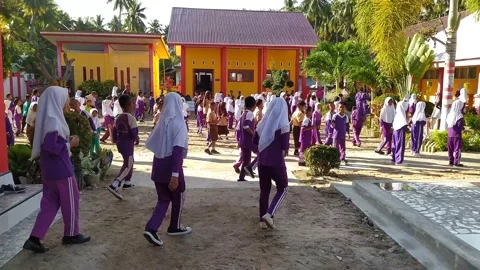 Elementary school children doing gymnastics.  Tompo Indonesia - 2023-2-17 Stock Footage 233403416