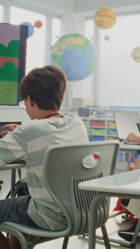 Elementary School Children Drawing Pictures on Laptops During Art Class. Teacher Stock Footage 315471925