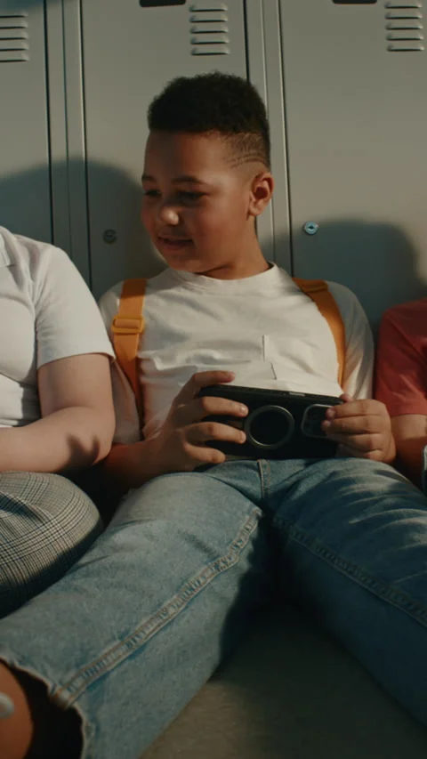 Elementary School Children Using Portable Gaming or Learning Devices Stock Footage 342022995