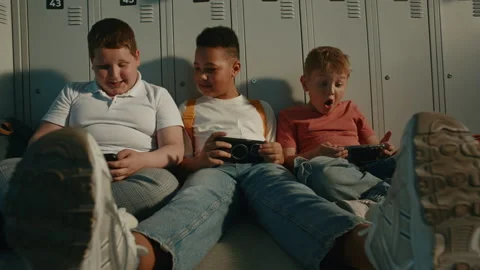 Elementary School Children Using Portable Gaming or Learning Devices Stock Footage 342024463