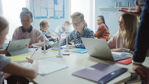 In the Elementary School: Class of Brilliant Young Children Work as a Team Stock Footage 119445169