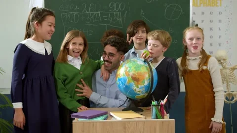 Elementary school class children communicate with the teacher answering question Stock Footage 232875540