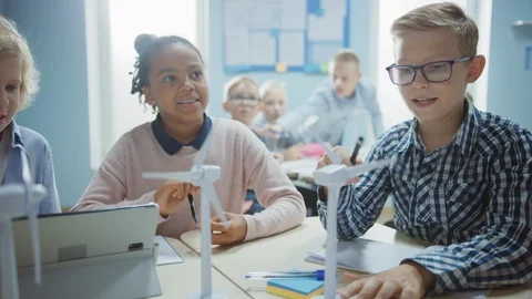 In Elementary School: Class of Smart Young Children Work as Team Using Tablet Stock Footage 119445238