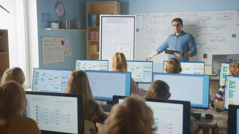 Elementary School Class: Teacher Uses Digital Whiteboard, Explain Lesson to Kids Stock Footage 119360544