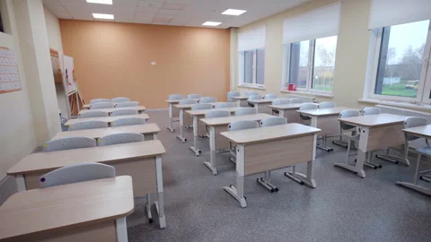 Elementary school classroom with desks arranged in rows Stock Footage 335193913