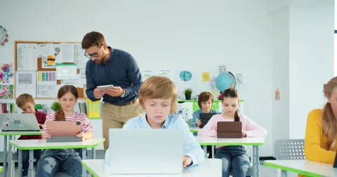 Elementary school computer science class. junior students girls and boys use Stock Footage 159673725