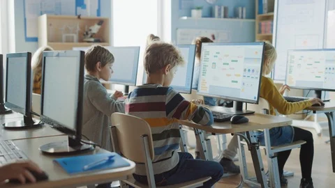 Elementary School Computer Science Classroom: Smart Schoolchildren Work on PC Stock Footage 119359417