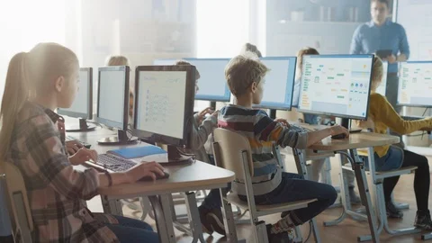 Elementary School Computer Science Classroom: Smart Schoolchildren Work on PC Stock Footage 119359421