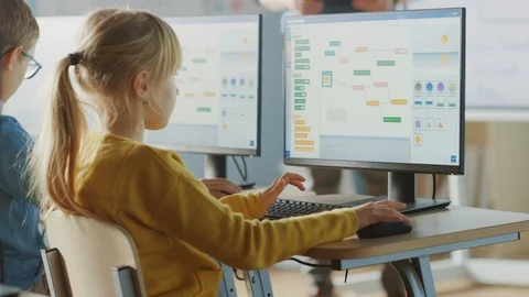 Elementary School Computer Science Classroom: Cute Little Girl Uses PC Stock Footage 119359579