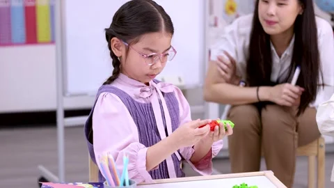 Elementary School Girl Solving Math with Colorful Counting Blocks Video stock 330995492