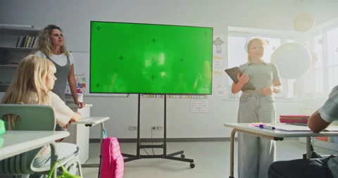 Elementary School Girl with Tablet Computer Giving Presentation. Digital Screen Stock Footage 315536987