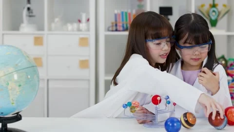 Elementary School Girls Studying Solar System Model in Science Lab Stock Footage 342686510
