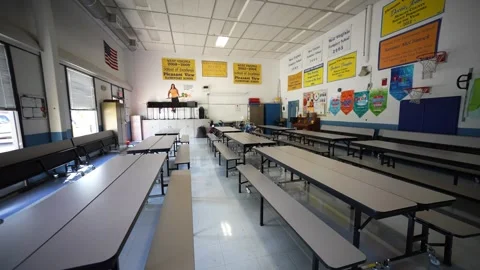 Elementary school gym used as a cafeteria in a small town elementary school. Stock Footage 248619370