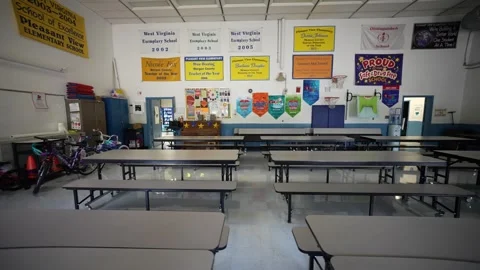 Elementary school gym used as a cafeteria in a small town elementary school. Stock Footage 248619554