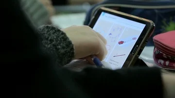Elementary school kid using digital tablet in classroom Stock Footage 85705447