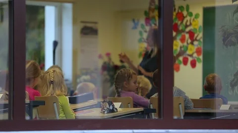 Elementary school kids in classroom Stock Footage 85705439