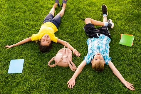 Elementary school kids having fun outdoors Stock Photos