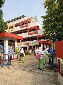 Elementary School, Queueing Student for Offline School or PTM Stock Photos