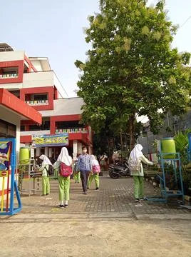 Elementary School, Queueing Student for Offline School or PTM Stock Photos
