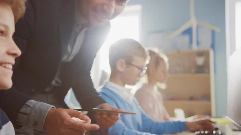 Elementary School Science Classroom: Enthusiastic Teacher Talks with a Schoolboy Stock Footage 119359676