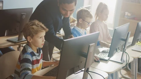 Elementary School Science Classroom: Enthusiastic Teacher Talks with a Schoolboy Stock Footage 119359714