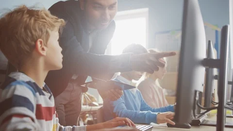 Elementary School Science Classroom: Enthusiastic Teacher Talks with a Schoolboy Stock Footage 119359725