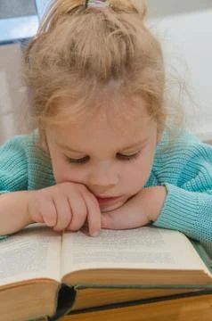 Elementary school student with a book Фото