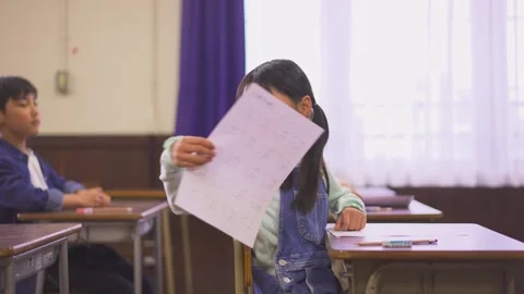 Elementary School Student Distributing Tests Vídeo Stock 332751149