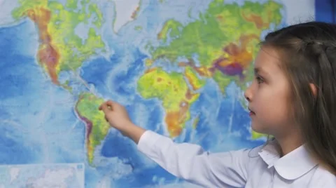 Elementary School Student Smiles by world map Stock Footage 68149833