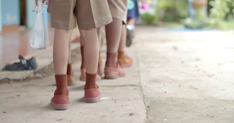 Elementary school students Asians line up neatly after school for lunch.	 Stock Footage 222619683
