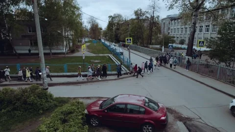 Elementary school students go to school in a group, aerial photography 스톡 동영상 195473399