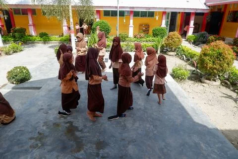 Elementary school students playing in the school environment Stock Photos