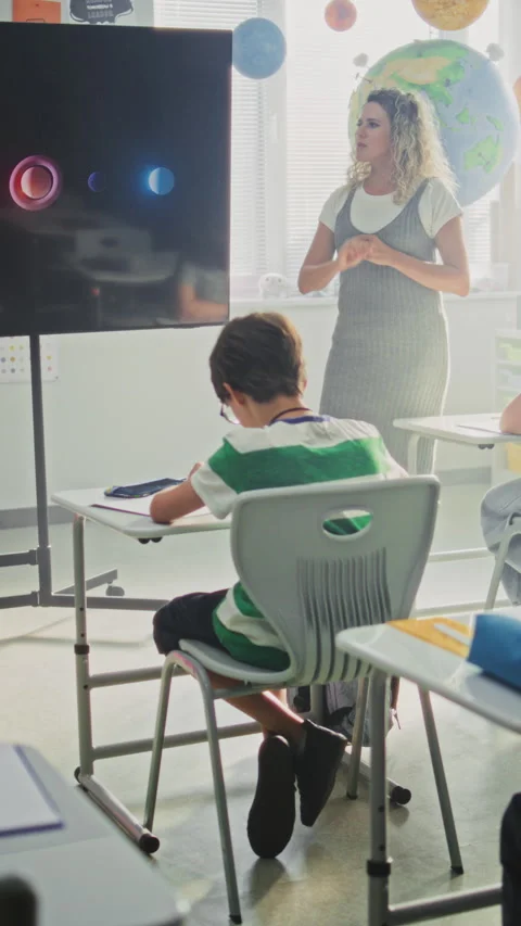 Elementary School Students Studying Basic Information About Solar System and Video stock 315535830