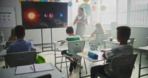 Elementary School Students Studying Basic Information About Solar System and Video stock 315536449