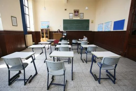 Elementary school students studying in classroom Stock Photos
