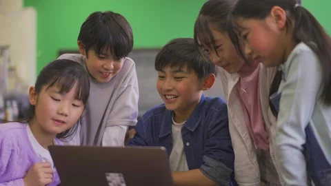 Elementary School Students Surrounding a Computer Stock Footage 332751096