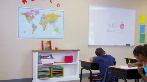 Elementary school students work at desks Stock-Footage 62281934