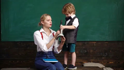 Elementary school teacher and student in classroom. Back to school. Elementary Stock Footage 114126944