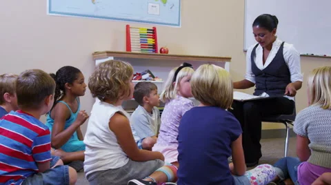 Elementary school teacher asks students a question Stock Footage 62281965