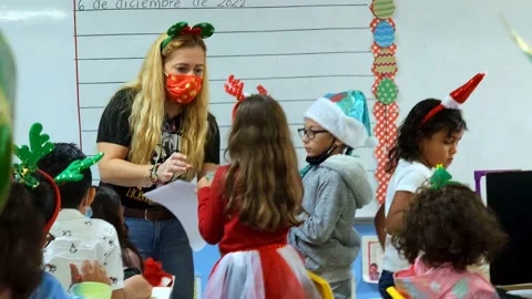 Elementary School Teacher Gives Snacks to Students Stock Footage 238029372