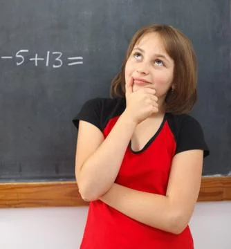 Elementary schoolgirl thinking on solution Stock Photos
