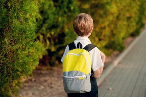 Elementary Student. Little 7 years old boy With backpack going to school Stock Photos