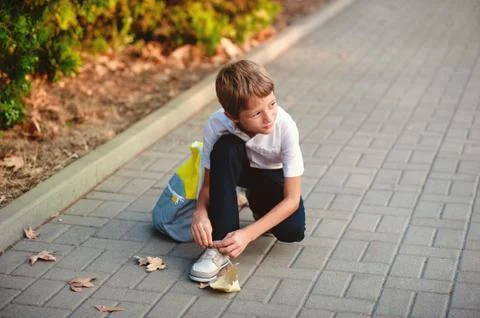 Elementary Student. Little 7 years old boy With backpack going to school Stock Photos