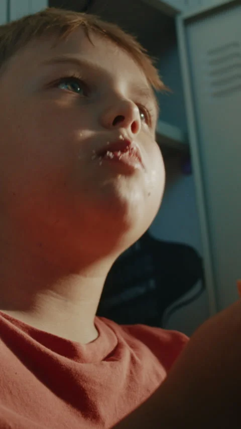 Elementary Student Taking Lunch Break While Eating Burger From Lunch Container Stock Footage 342027251