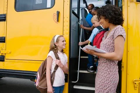 Elementary Students Boarding School Bus Stock Photos